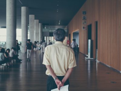 Community College Professor walks through the halls